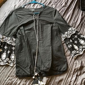 Wide sleeve black w/white lace + Pom Pom accents.